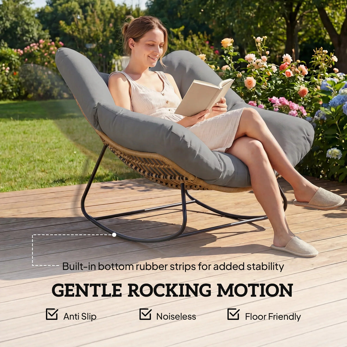 Grey oversized rocking egg chair with thick cushion and woven rattan base, side view