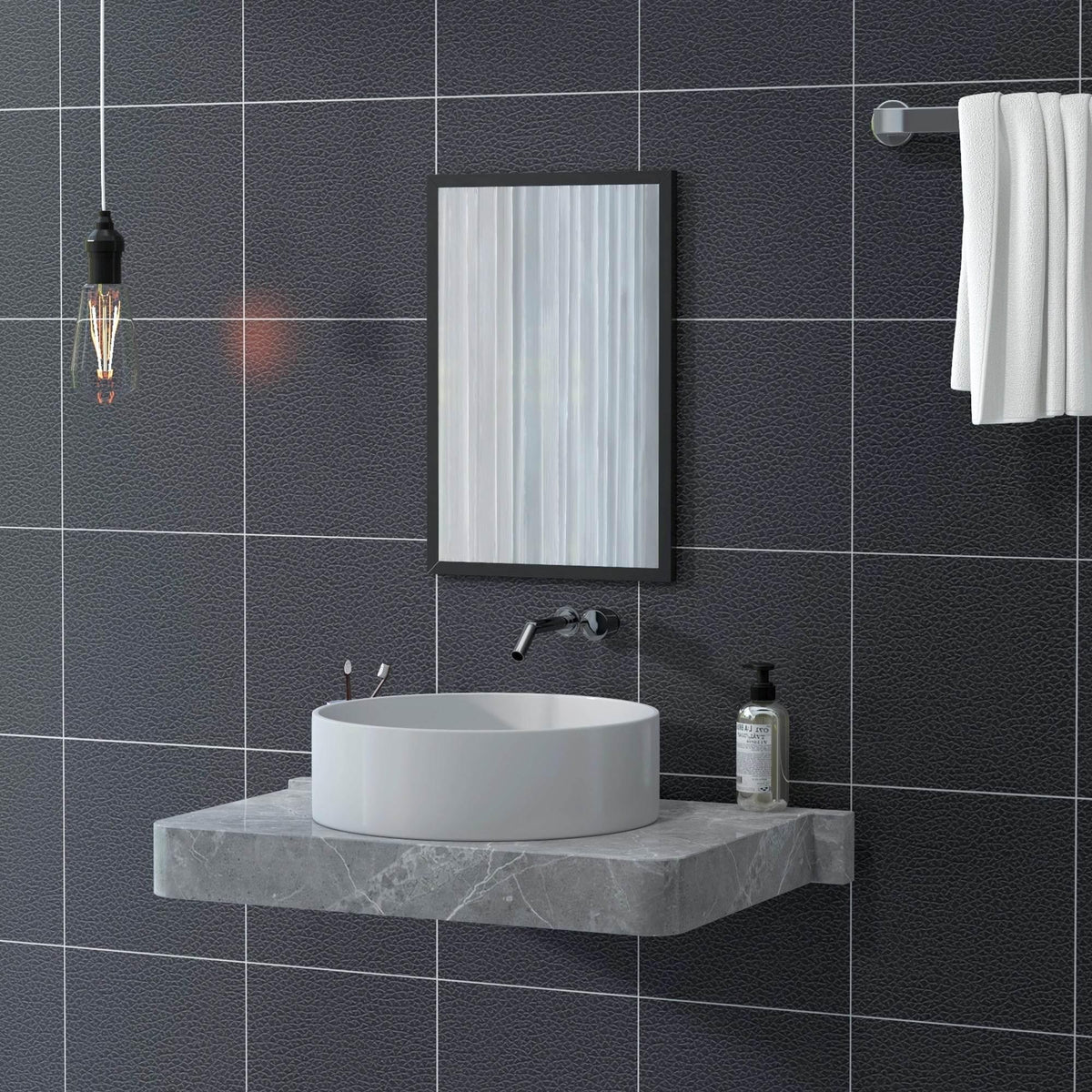Rectangular black wall mirror with slim frame mounted above a bathroom vanity