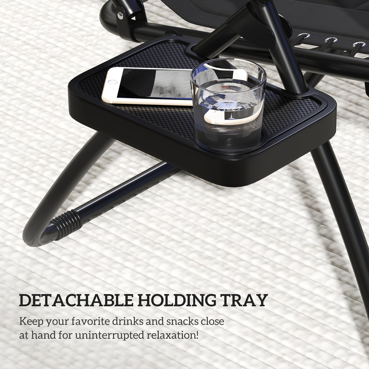 Black detachable holding tray with cup holder on the side of a zero-gravity lounger