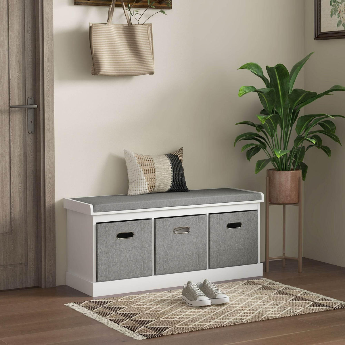 HOMCOM white shoe storage bench with padded gray seat and three fabric drawers, cut-out handles