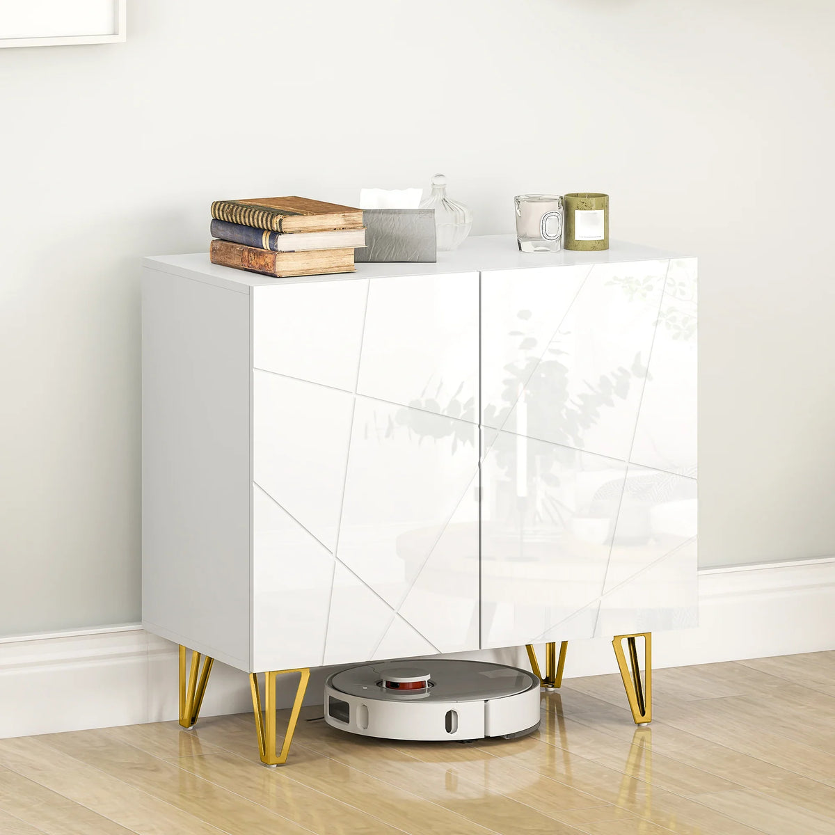 White glossy sideboard with two doors and gold hairpin legs, robot vacuum nearby.