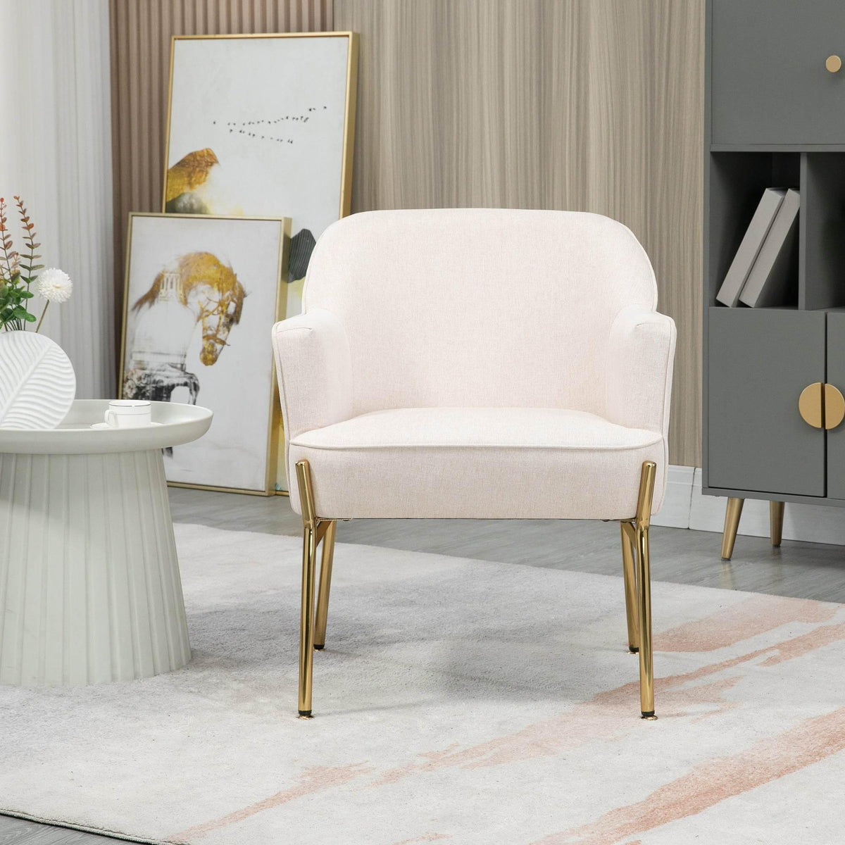 Cream armchair with rounded back, upholstered seat, and shiny gold legs
