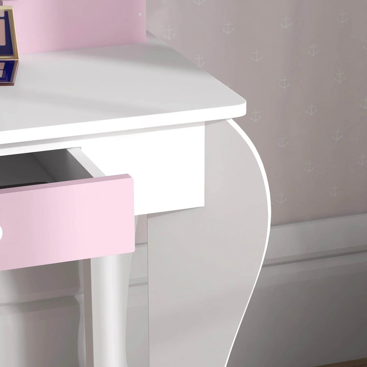 Close-up of white vanity tabletop edge and curved front side panel with pink drawer