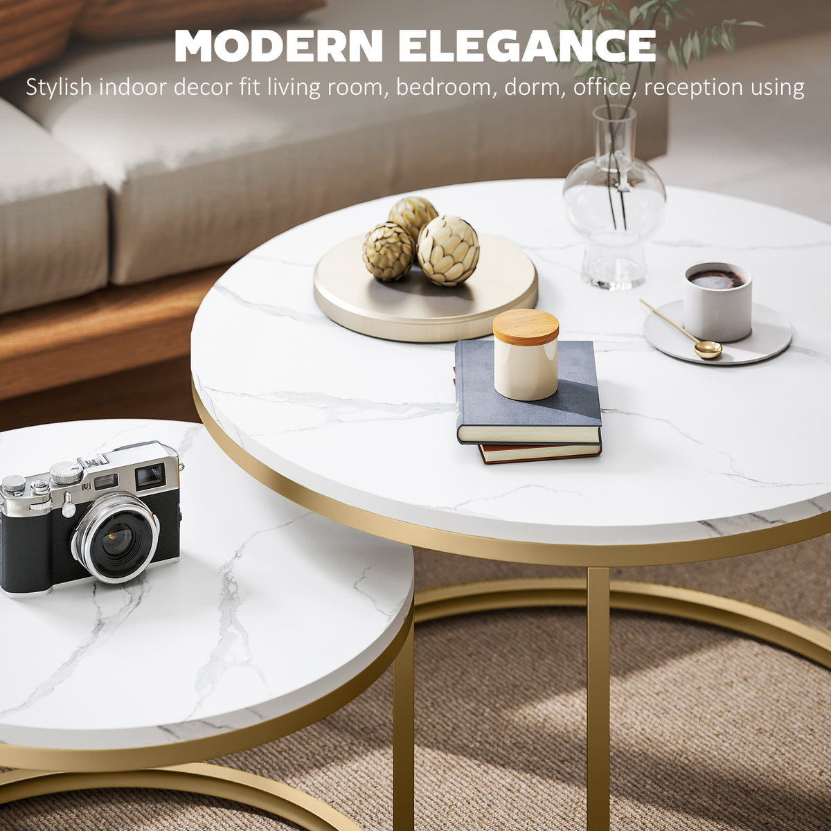 Round coffee table with marble-look top and gold steel base, decor on surface