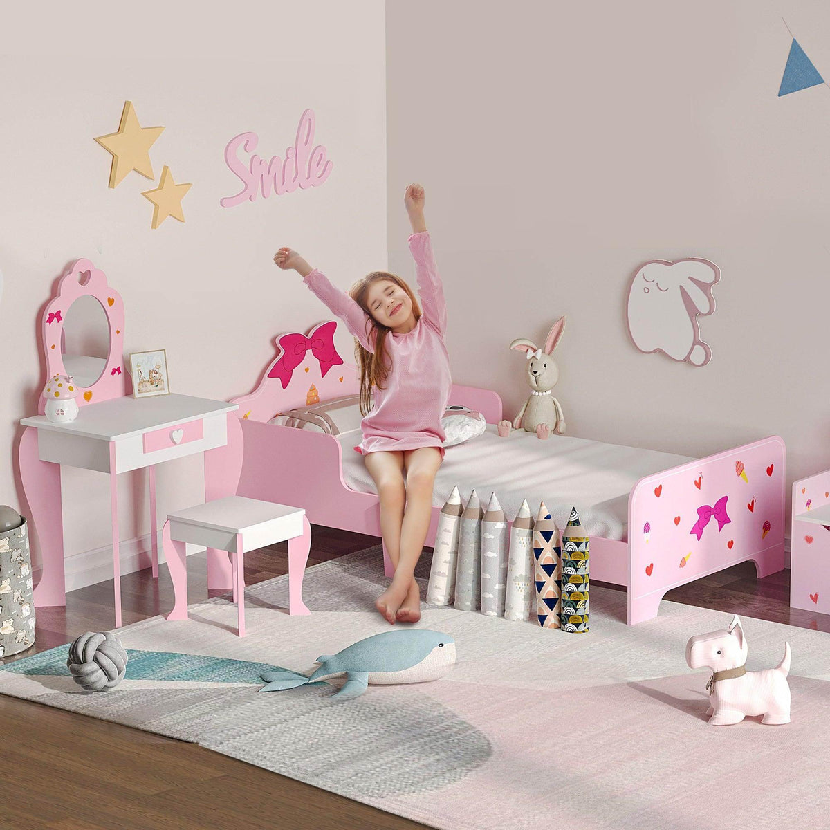 Pink kids bedroom furniture set with twin-size bed, side rails, and princess decor
