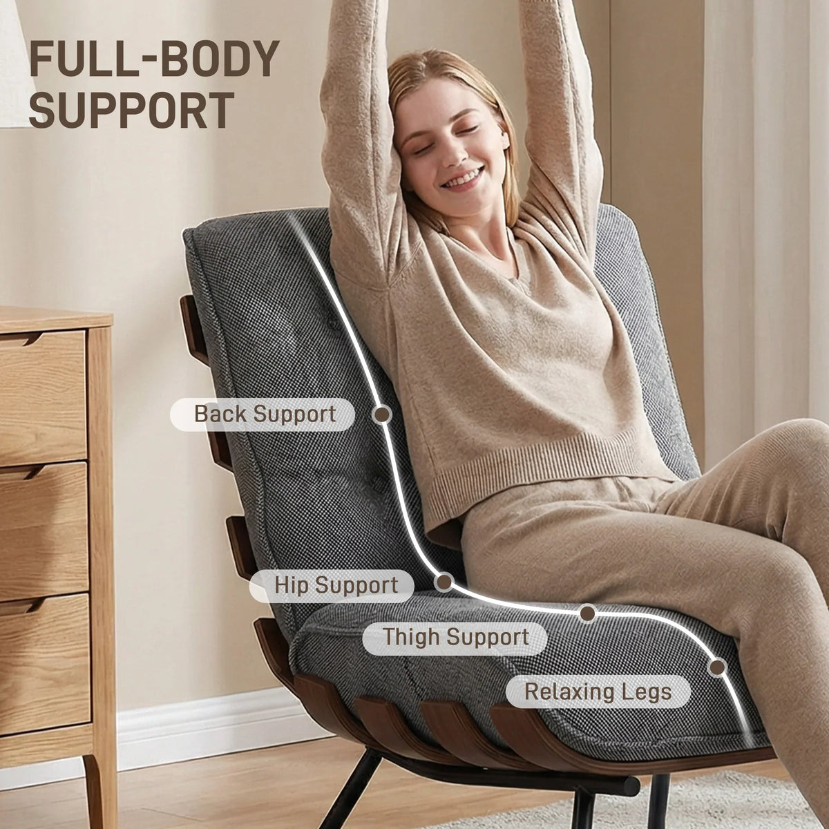 Dark grey reading chair with supportive armrests and tufted backrest design