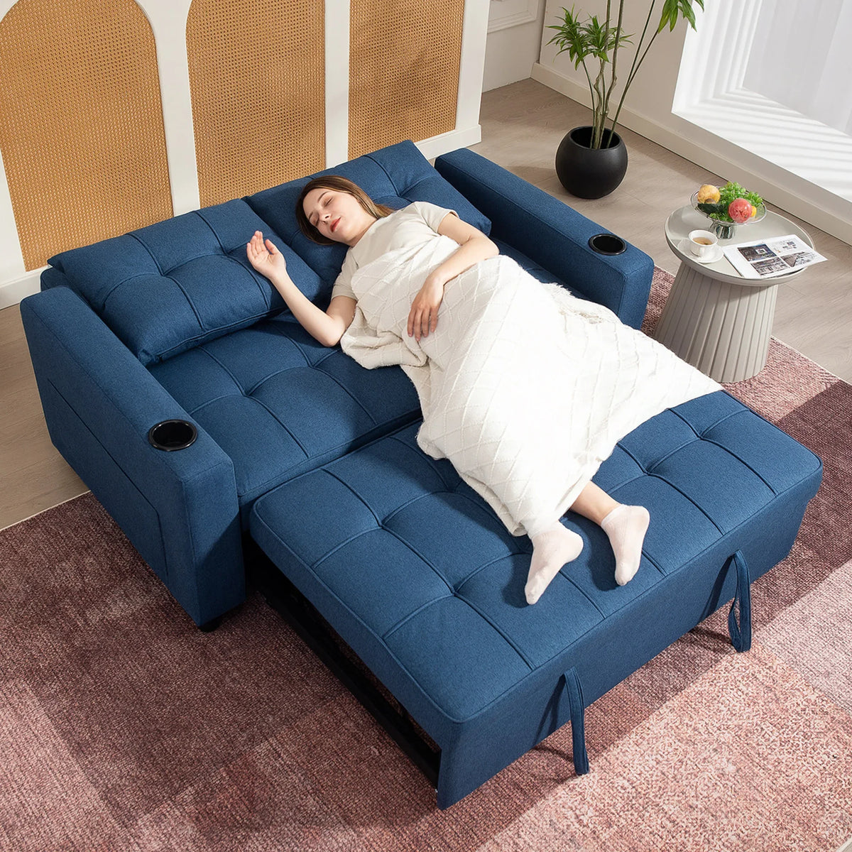 Dark blue pull-out sofa bed in lounge/sleep position with mattress fully extended