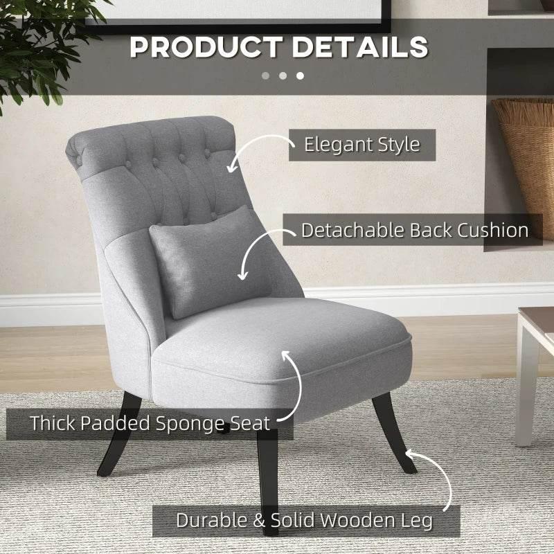 Grey upholstered tub chair with tufted back and arm seat cushion; detachable back cushion shown.