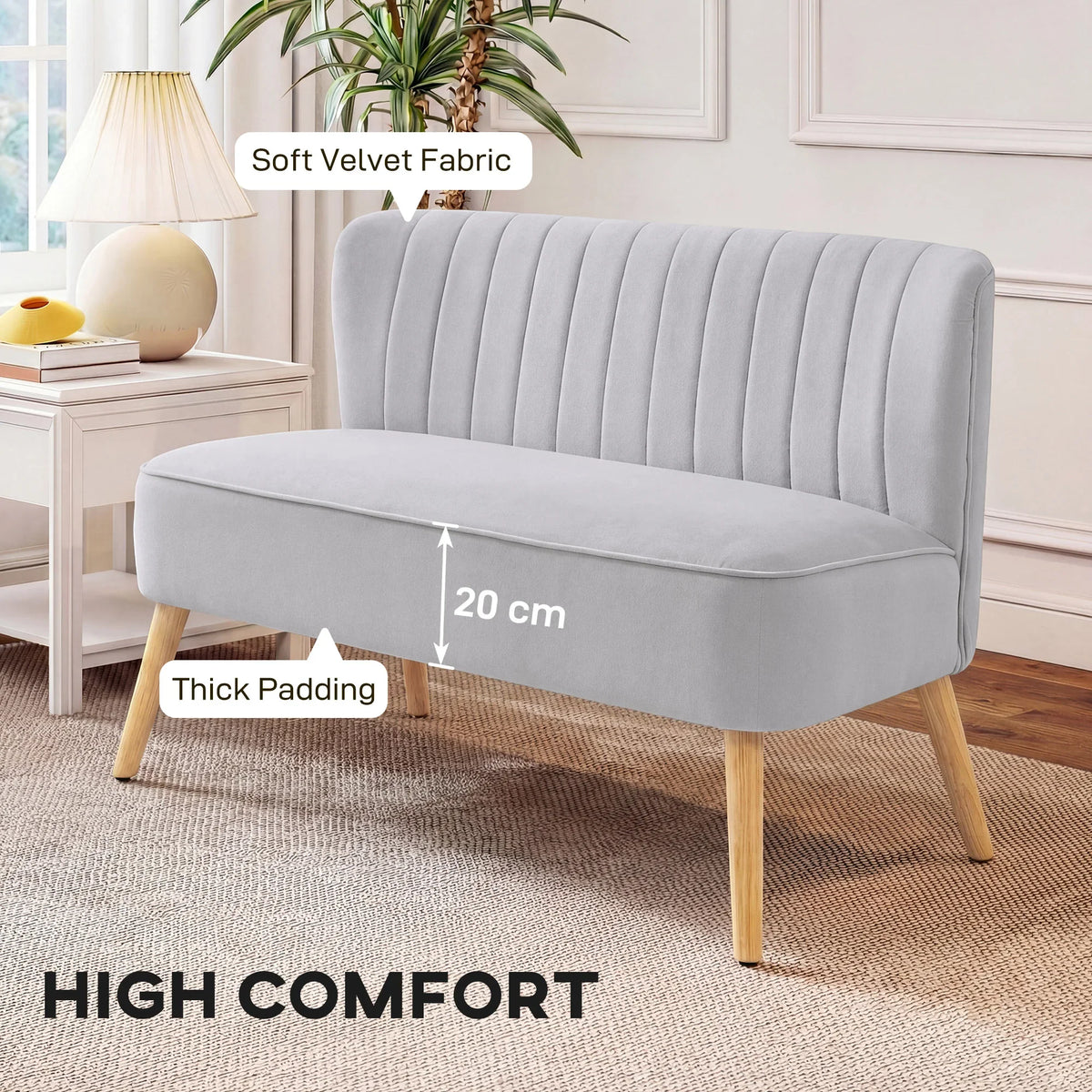 Light grey velvet double-seat sofa with vertical channel tufting and thick padded cushions
