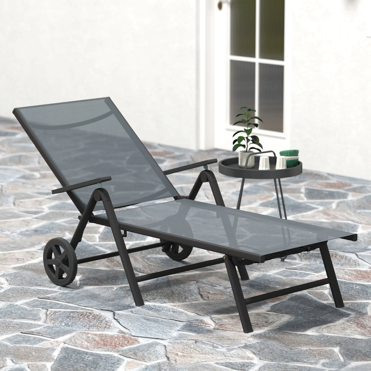 Grey reclining lounge chair with textilene mesh seat and backrest on patio