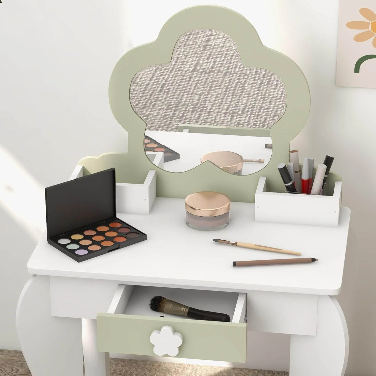 White kids vanity table with flower-shaped mirror, makeup organizers, and storage drawers