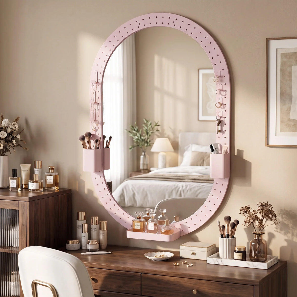 Oval wall mirror with pink pegboard frame hooks for organizing small items