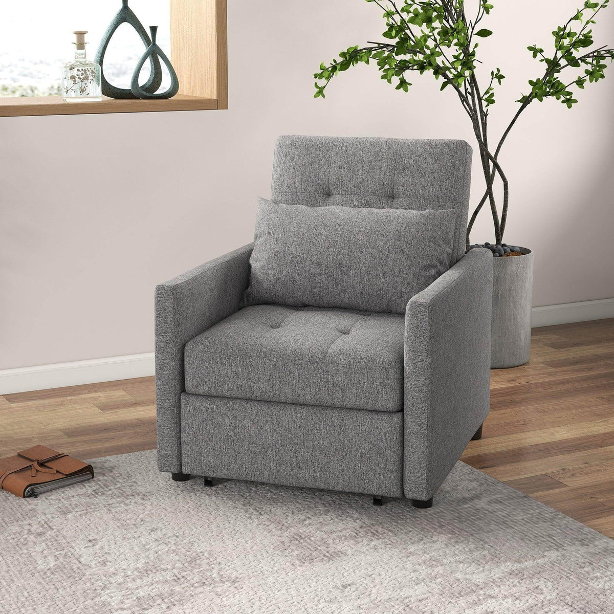 Grey convertible single chair bed with tufted backrest and padded armrests