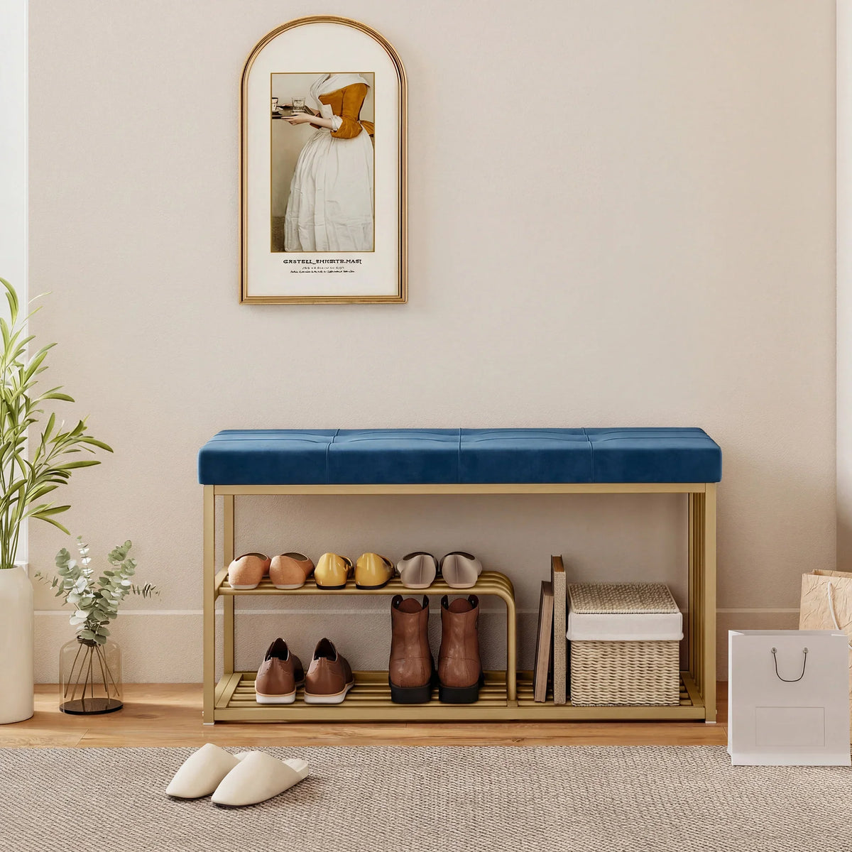 Dark blue tufted shoe bench with gold-tone open two-tier shoe rack