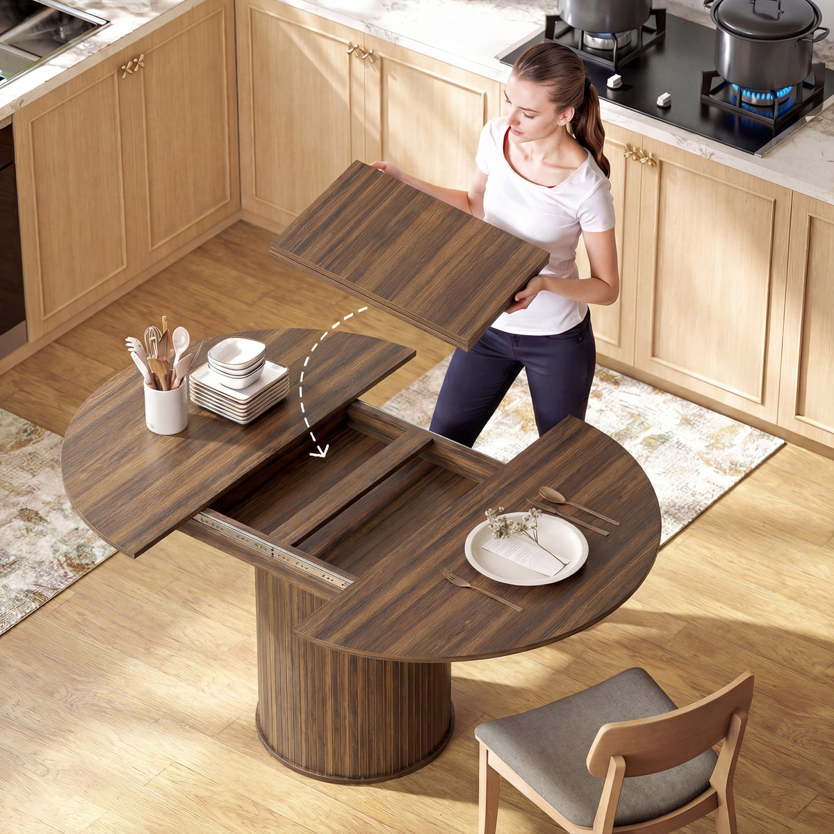 Round extendable dining table with hidden leaf storage, open panels, dark wood pedestal base