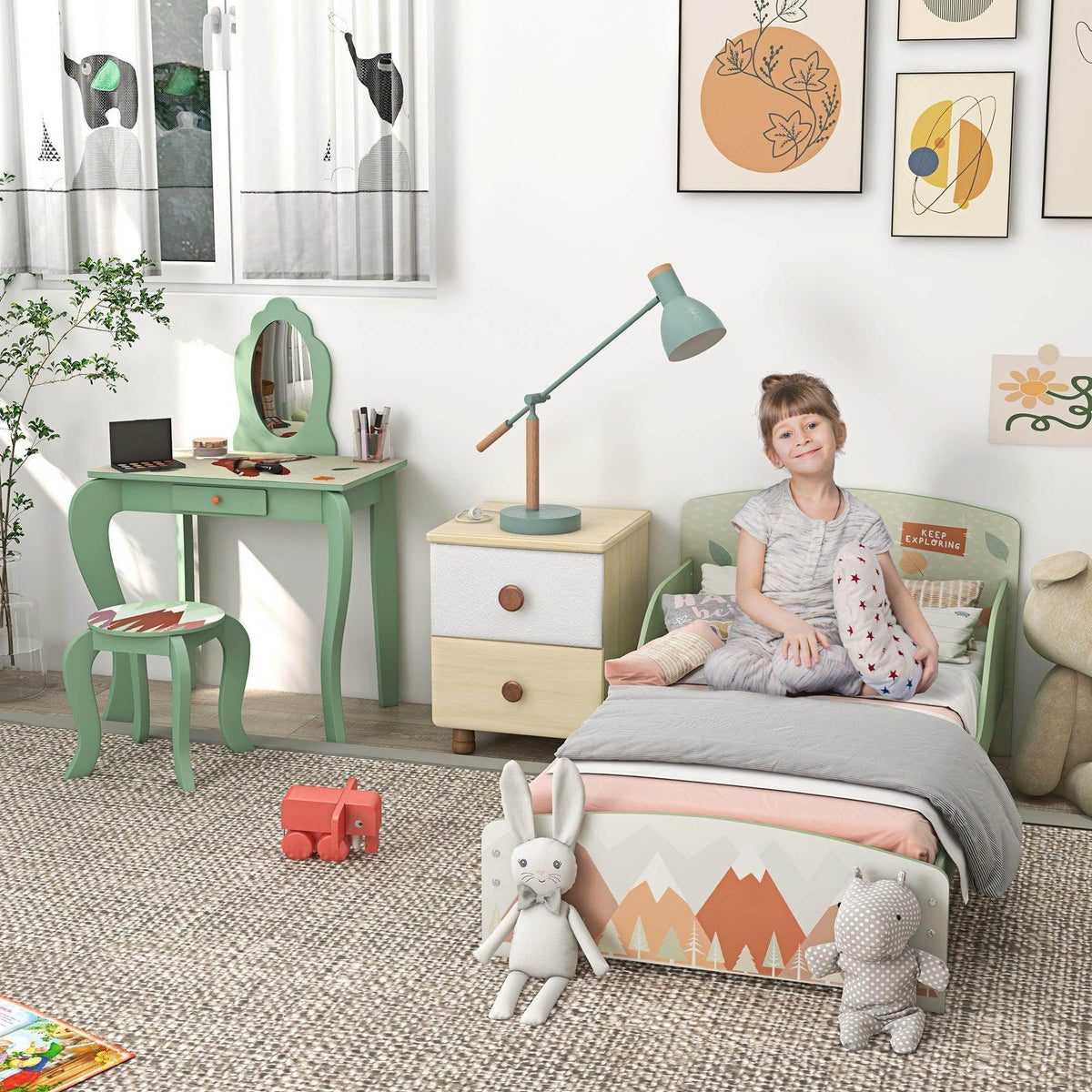 Sage green toddler bed frame with mountain and woodland animal print panel