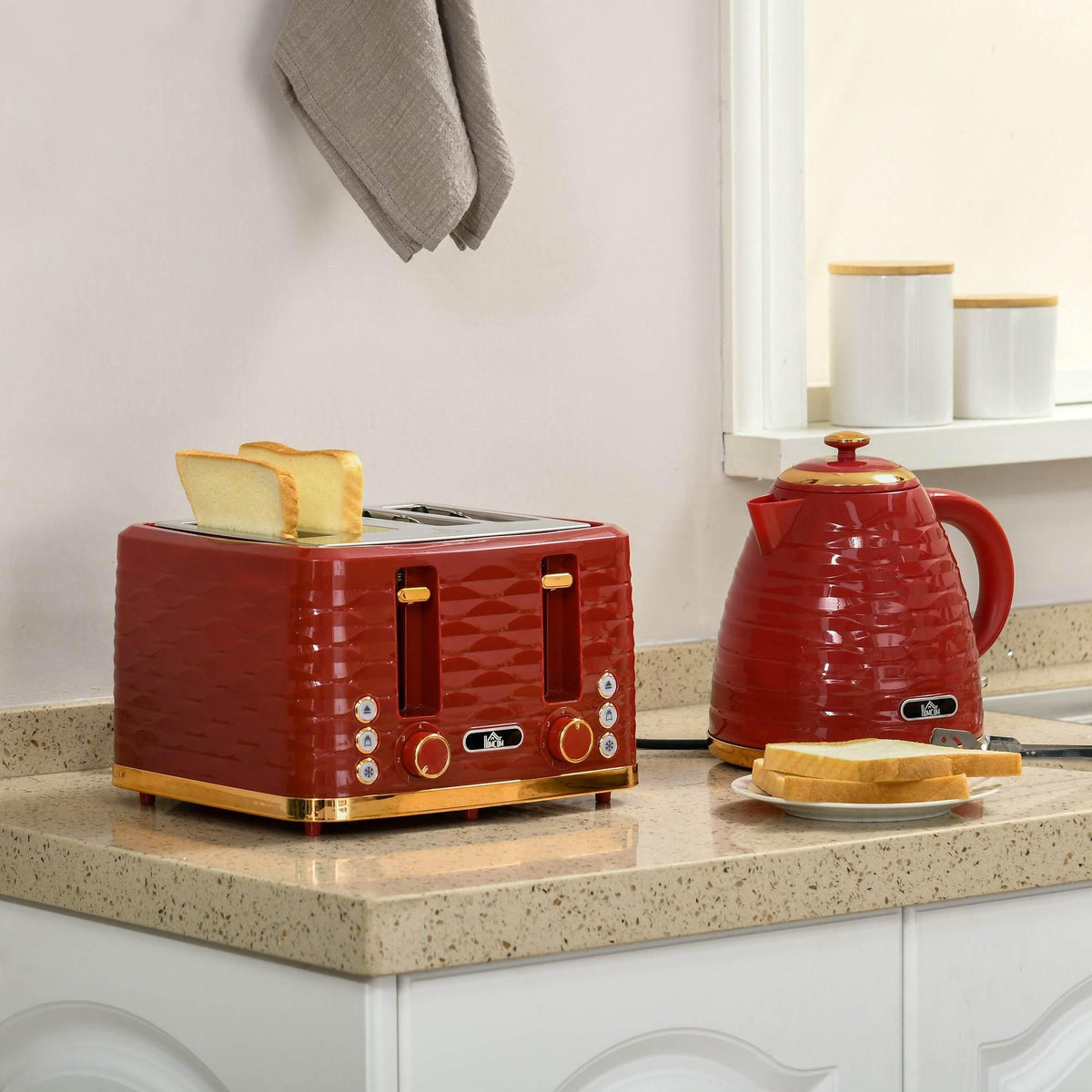Red toaster and kettle set on countertop