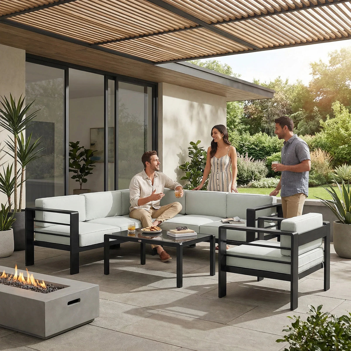 Light grey garden corner sofa set with cushions and black coffee table on patio