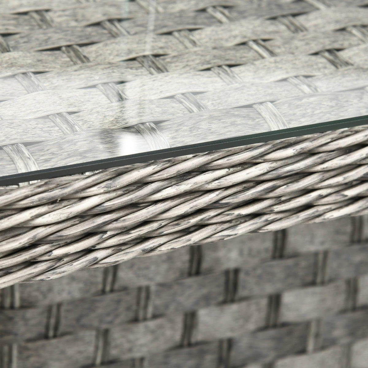 Close-up of woven gray rattan wicker lattice with dark edge trim
