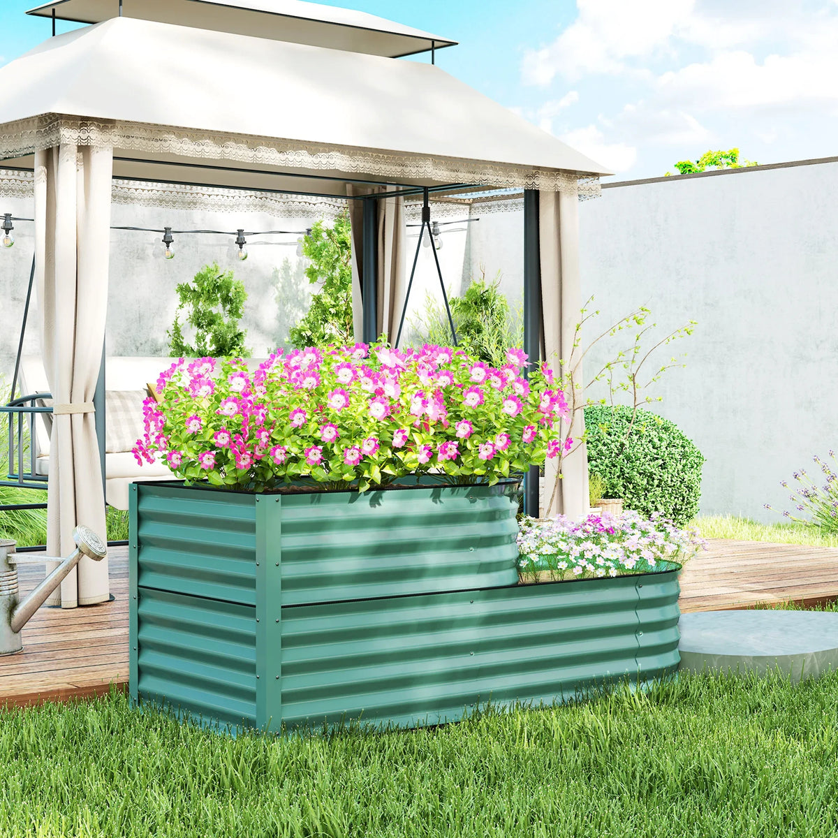 Two-tier dark green outdoor garden planter with ribbed panels, holding flowering plants