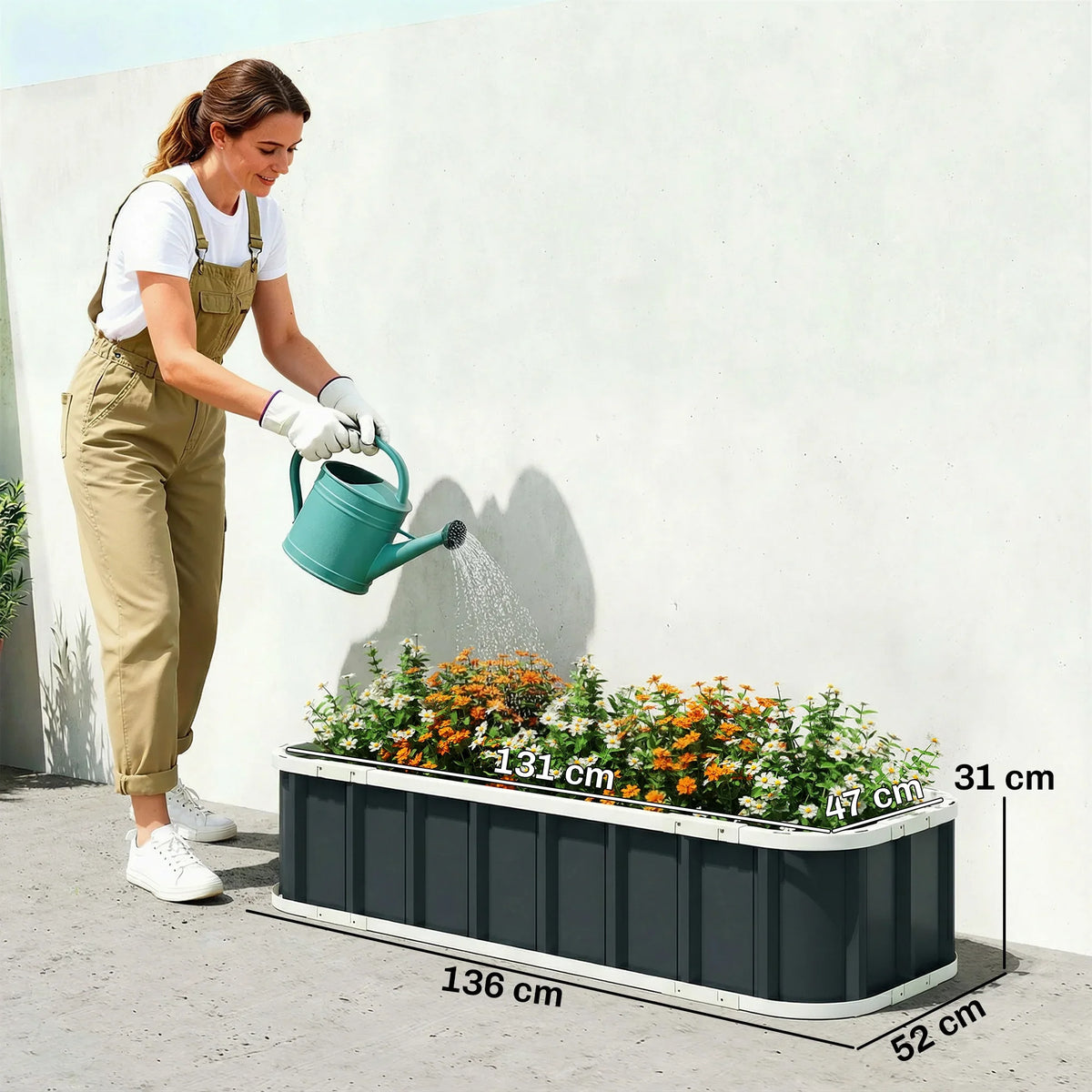 Dark grey metal planter bed for flowers, open-bottom raised frame with folded edges