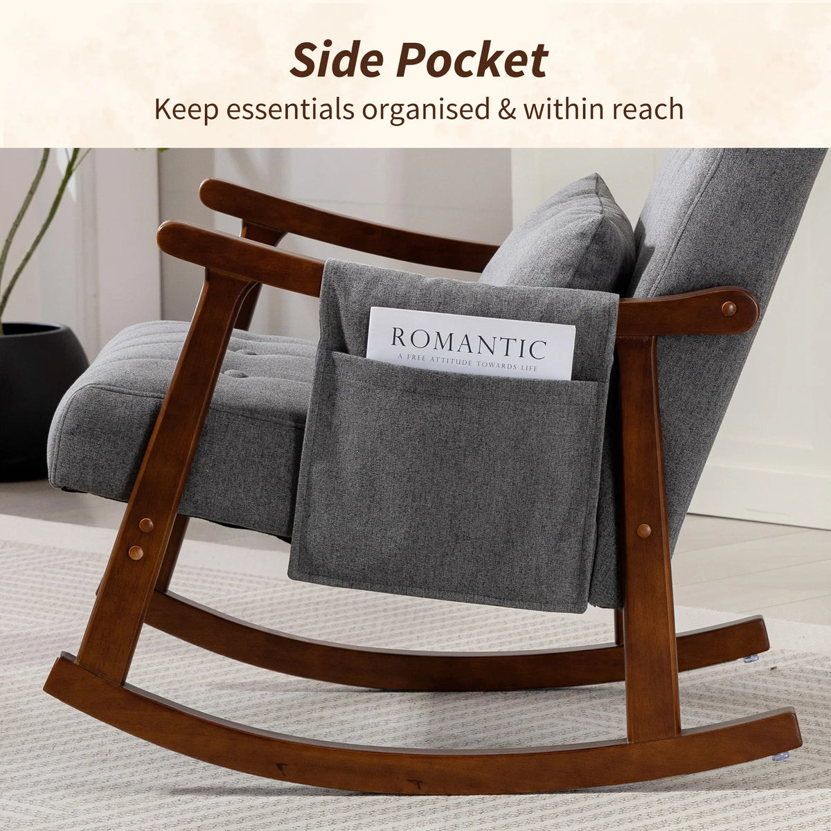 Grey rocking armchair with dark wood arms and side pocket organizer