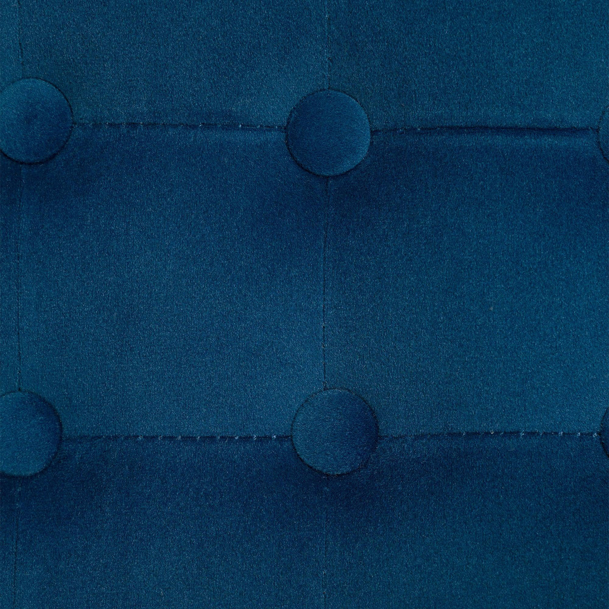 Blue tufted ottoman upholstery with round button details and stitched seams