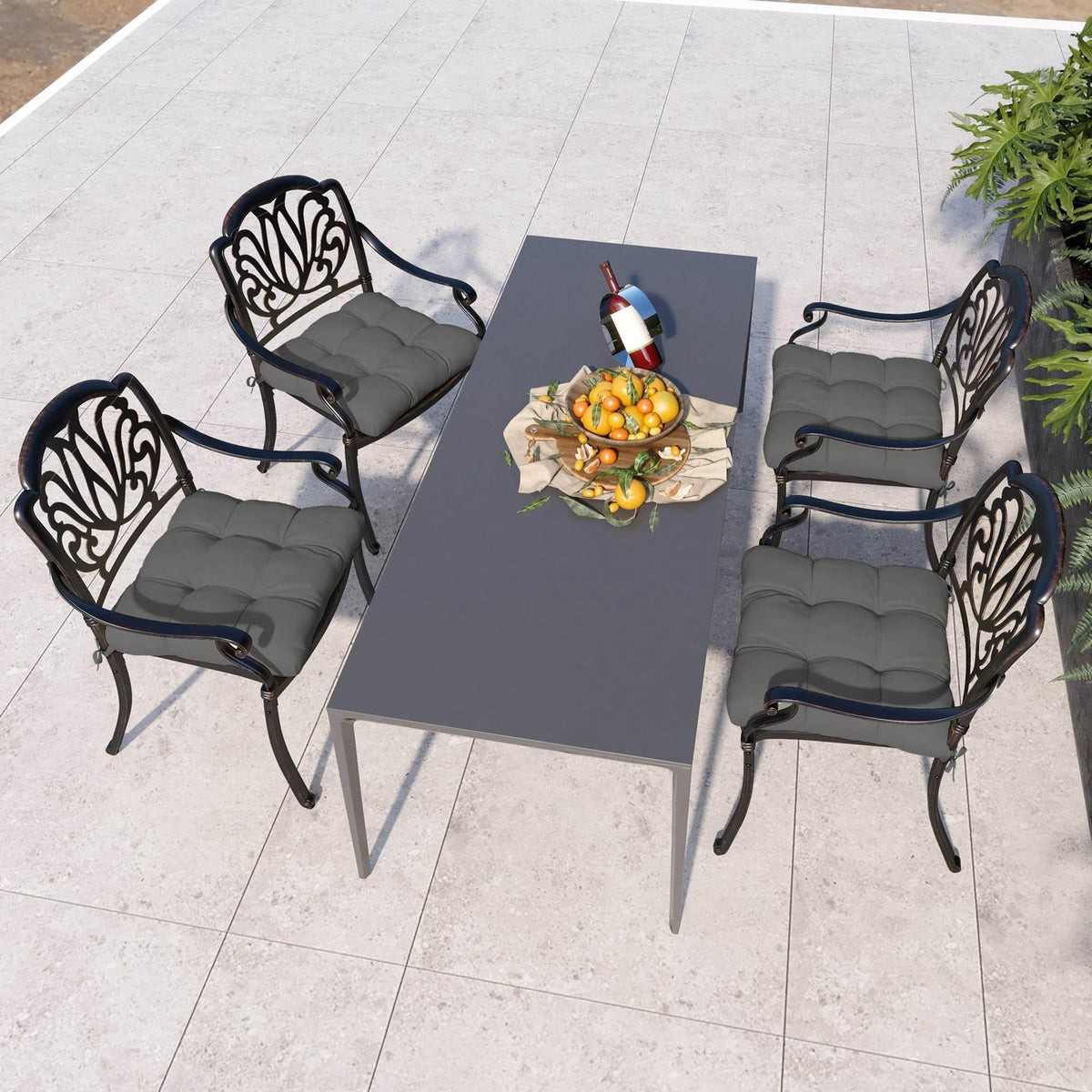 Charcoal grey 4-piece patio chair seat cushion set with tufted, padded seats
