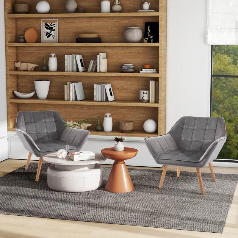 Set of 2 grey upholstered armchairs with wide arms, slanted backs, rubber wood legs