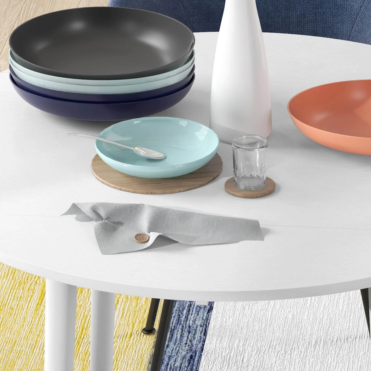 White round drop-leaf dining table close-up with tabletop edge and legs