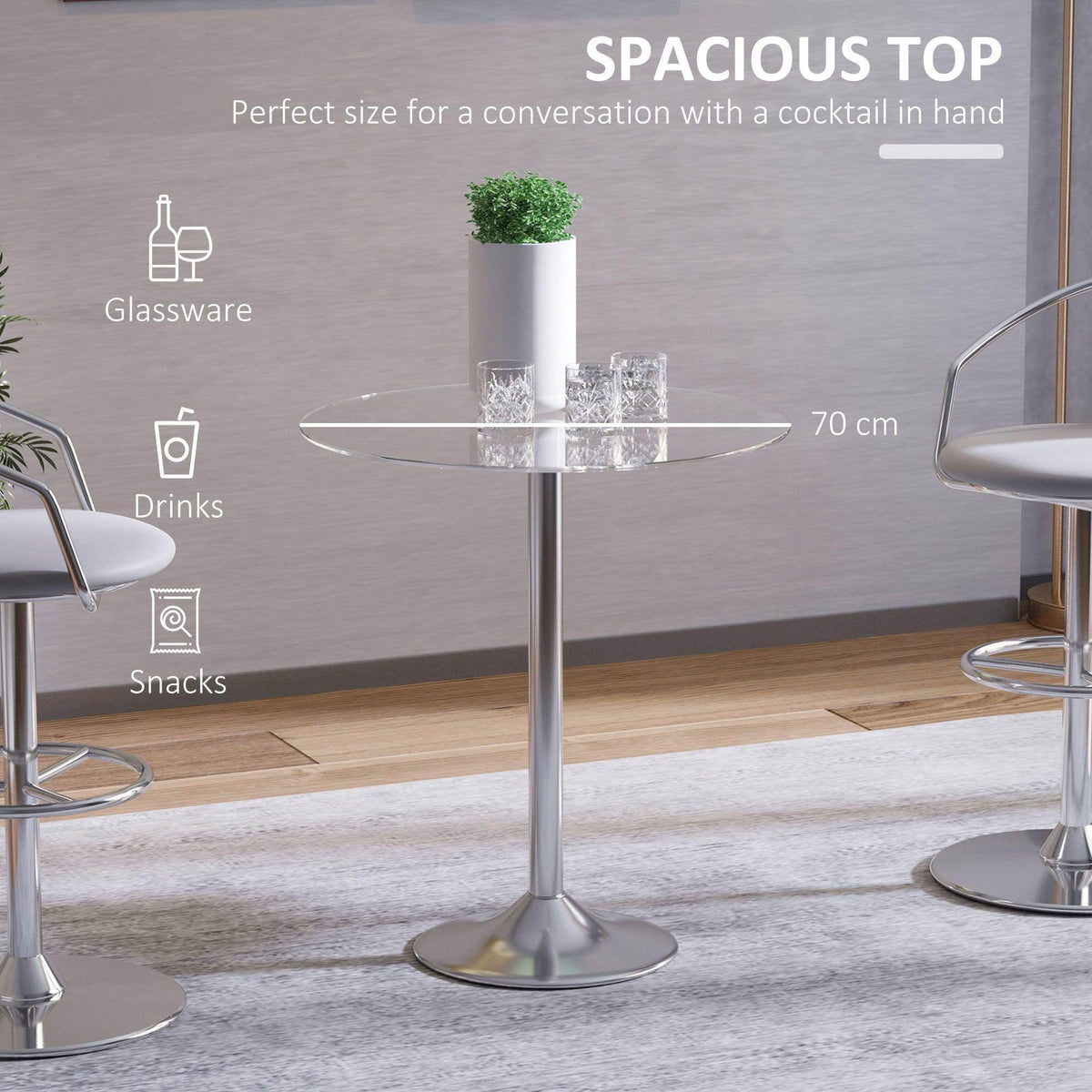 Round glass top table with polished steel pedestal base for drinks and small snacks.