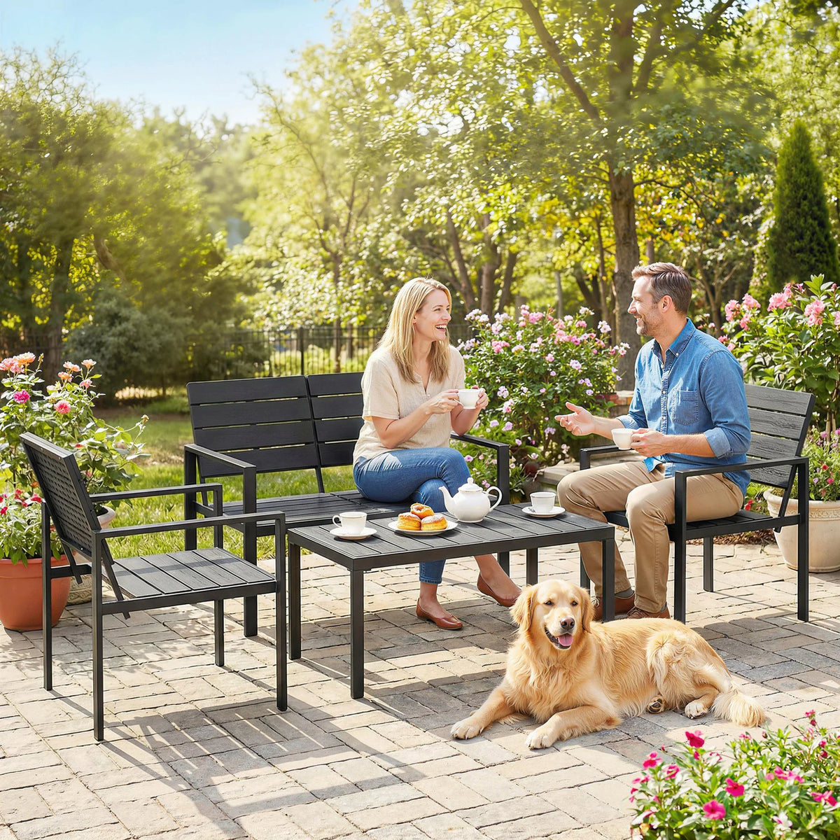 Black patio loveseat set with coffee table and 2 armchairs outdoors, with dog nearby.