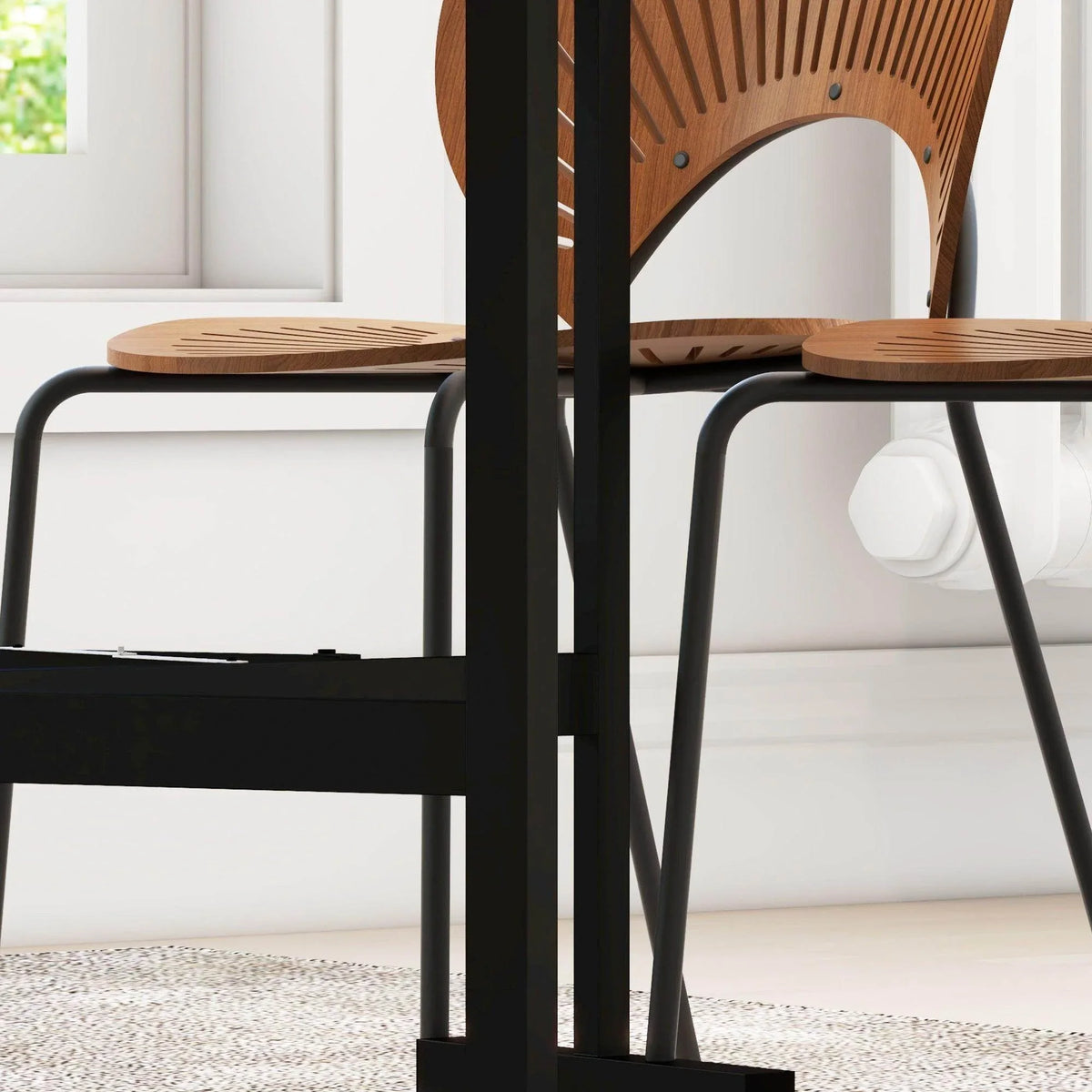 Black underside supports of a drop-leaf folding dining table above caster wheels