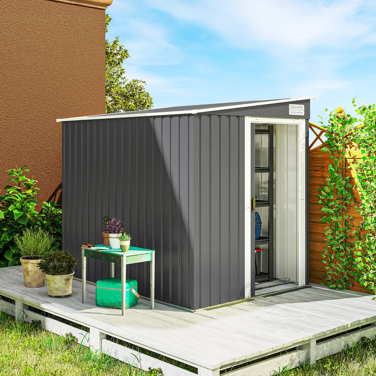 Dark grey metal garden shed with sliding door, open entry on patio platform.