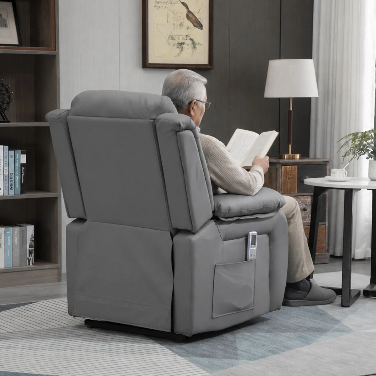 Grey power lift recliner chair with reclined back and raised foot position, PU leather look