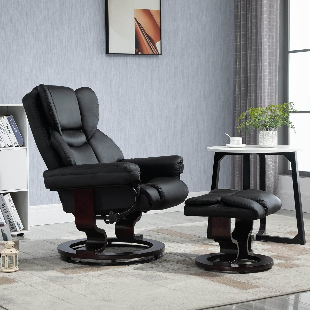 Black reclining swivel chair with padded faux leather back and matching ottoman