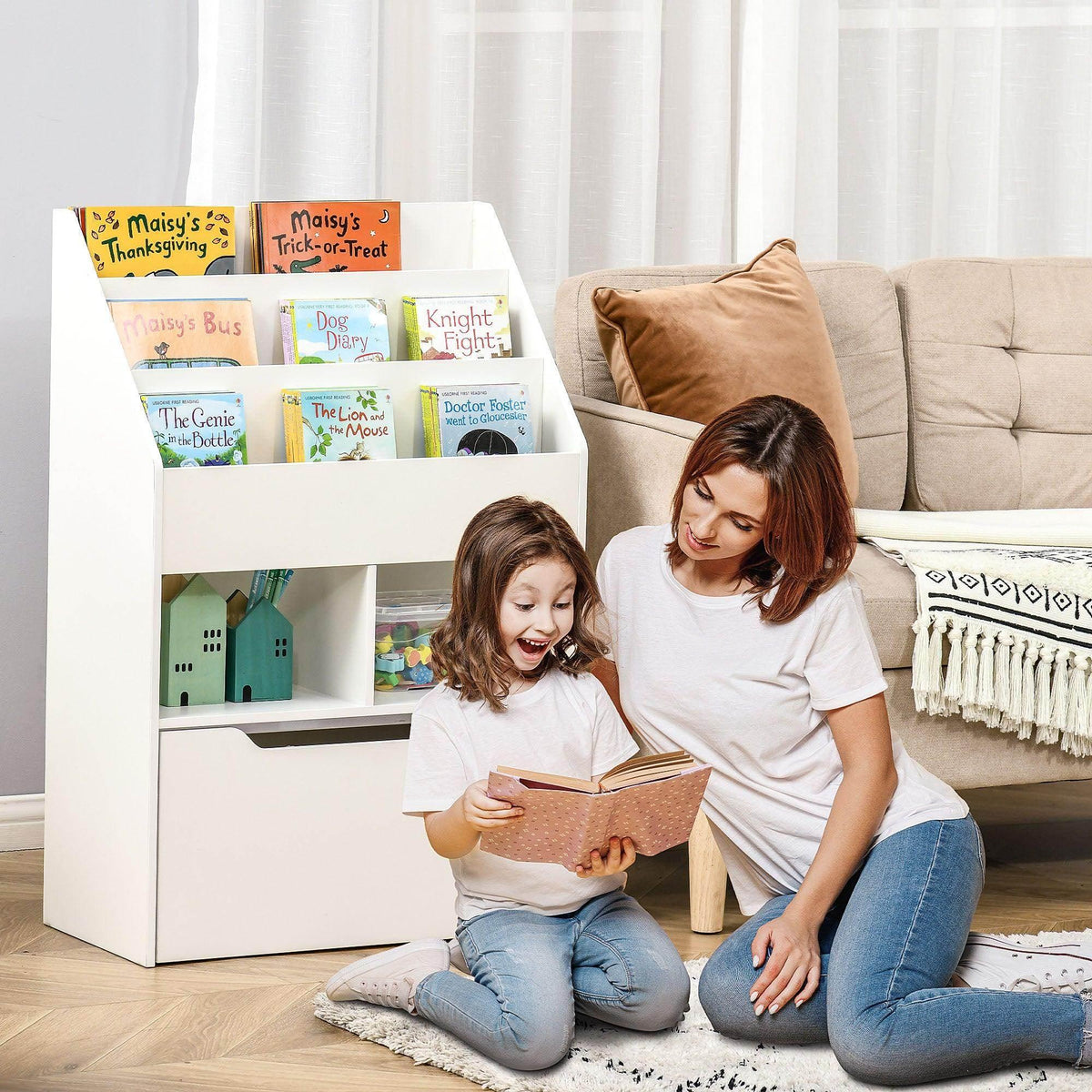 White kids bookshelf toy box with open storage shelves and drawer, used for book keeping.