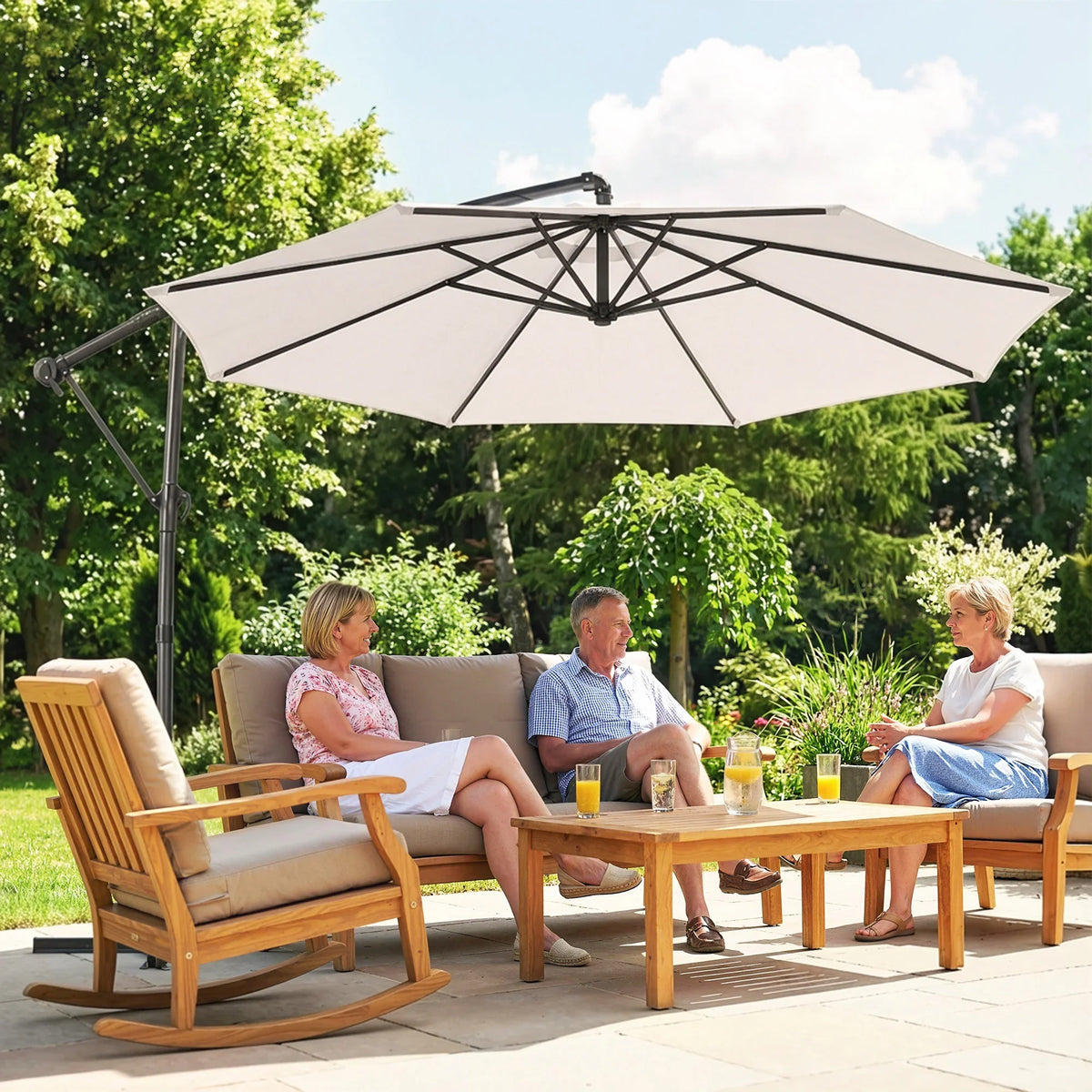 Cream cantilever parasol with round overhanging canopy above outdoor lounge area