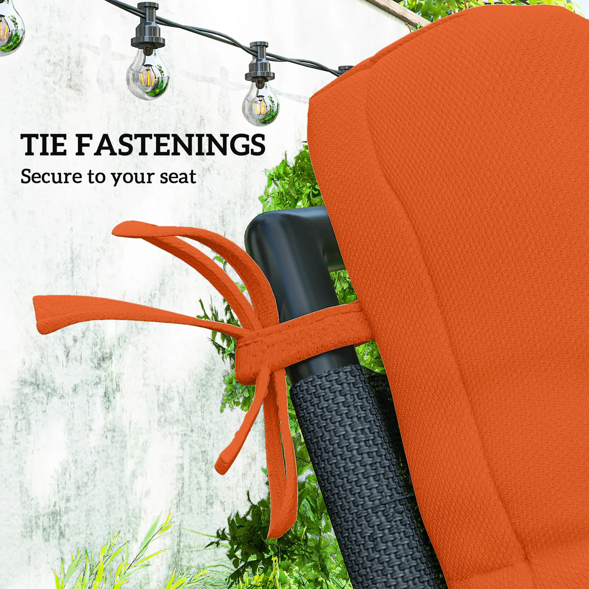 Orange padded outdoor seat cushion with backrest and tie straps for fastening