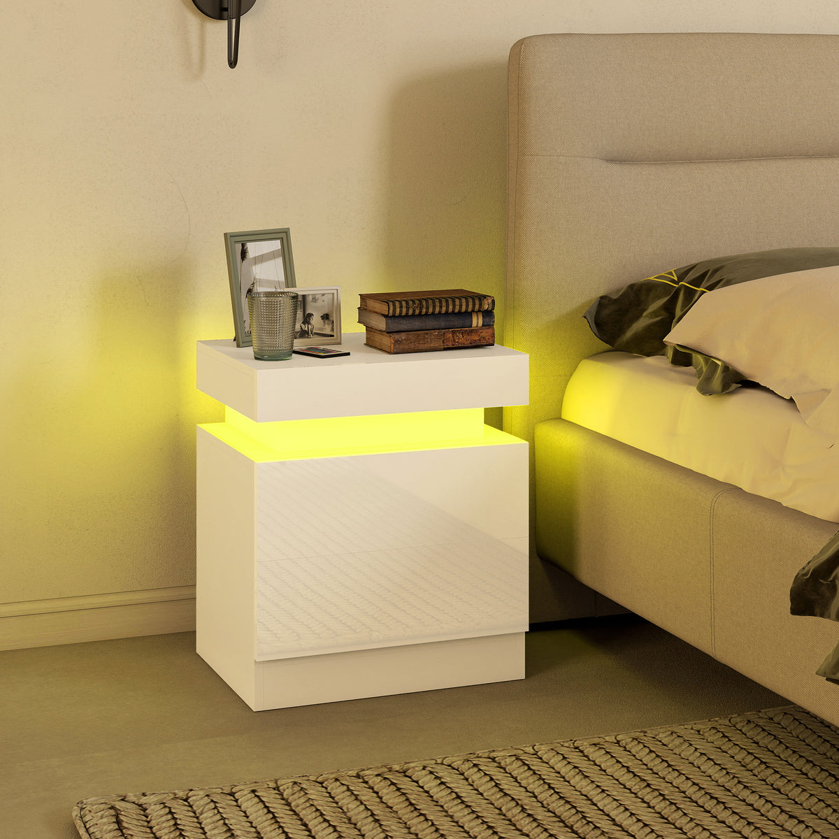 White LED bedside table with two drawers and warm yellow glowing light beside sofa