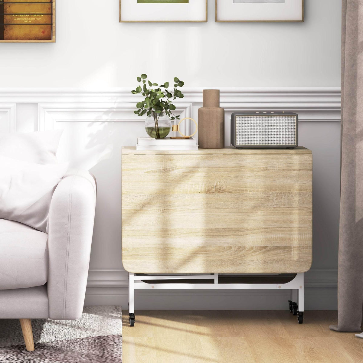 Folding dining table with front cabinet storage, light wood top, casters at base.