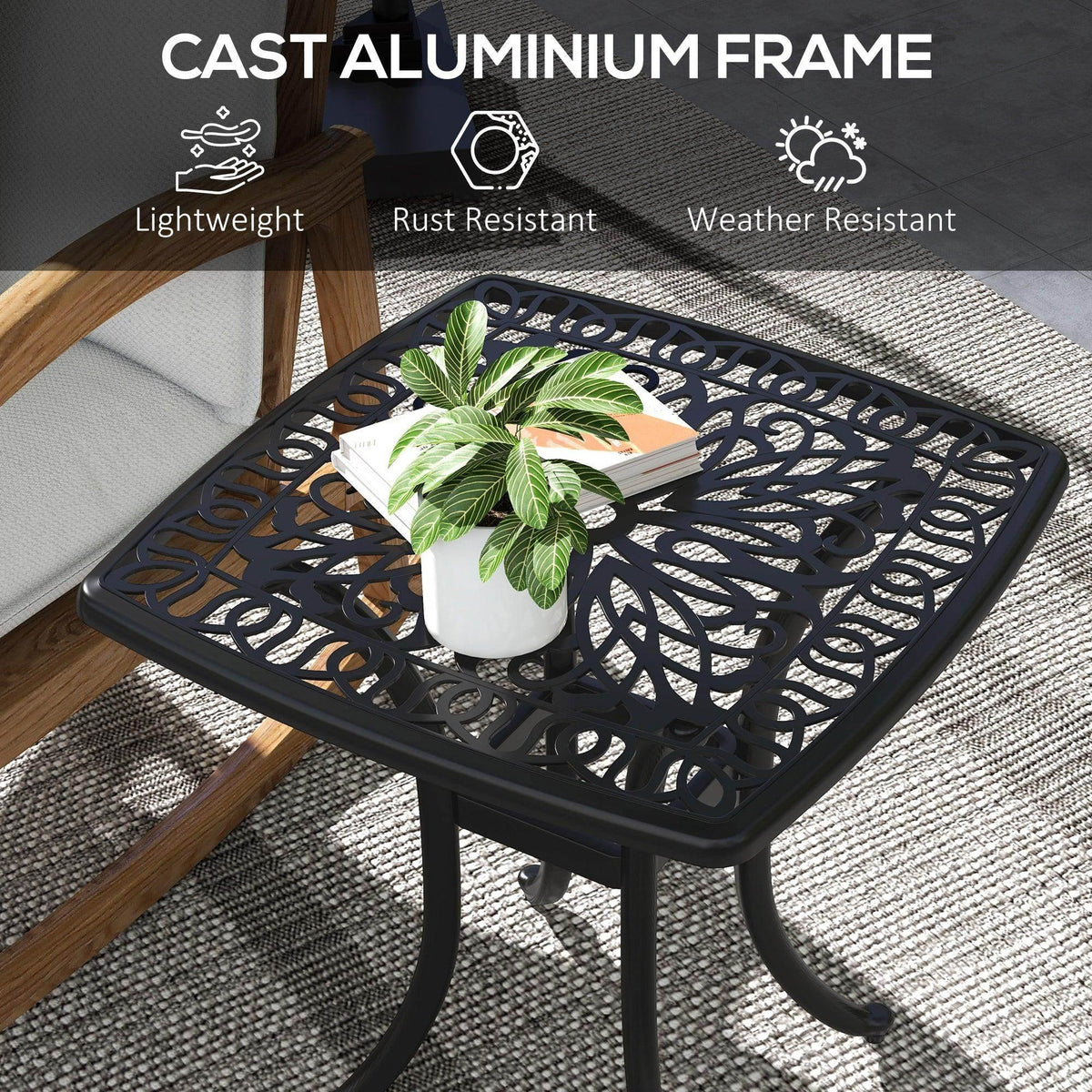 Black cast aluminum bistro table with open lattice top and sturdy cast frame