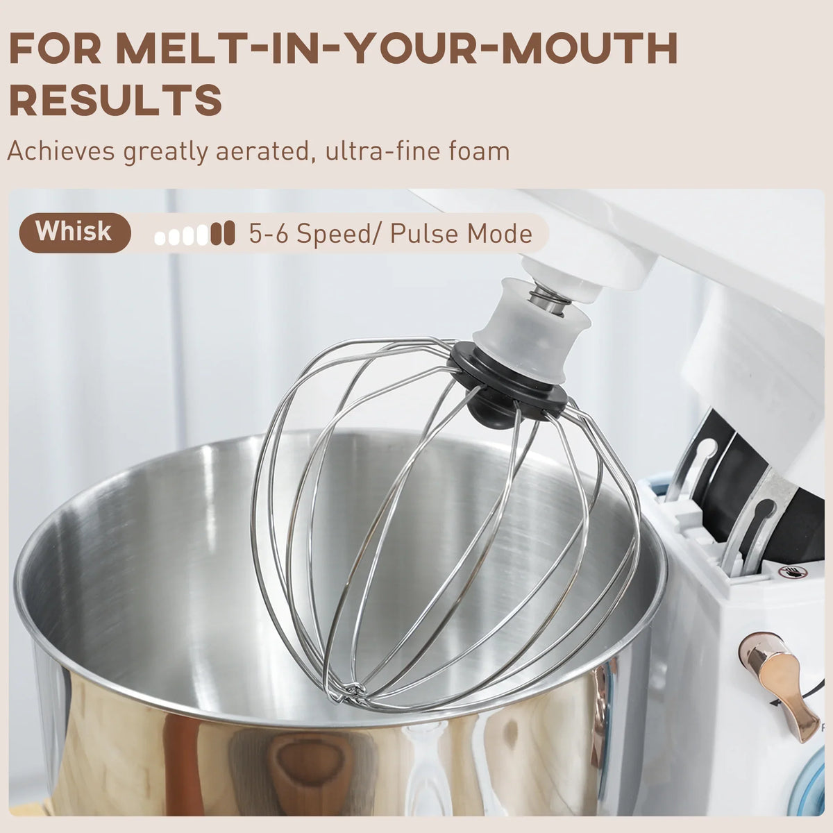 Stand mixer with whisk attachment over stainless bowl with blue speed/pulse mode dial.