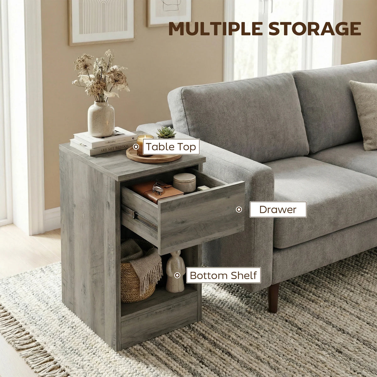 Grey wood-effect end table with top shelf, drawer, and bottom compartment storage