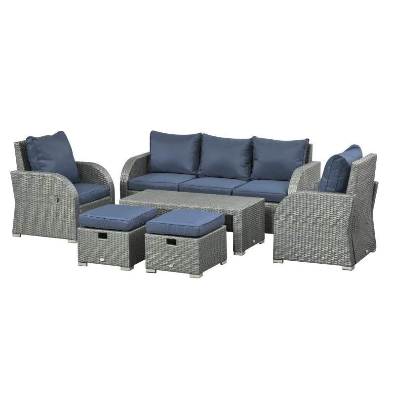 Outdoor rattan dining set with blue cushion sofa, armchairs, and matching ottoman