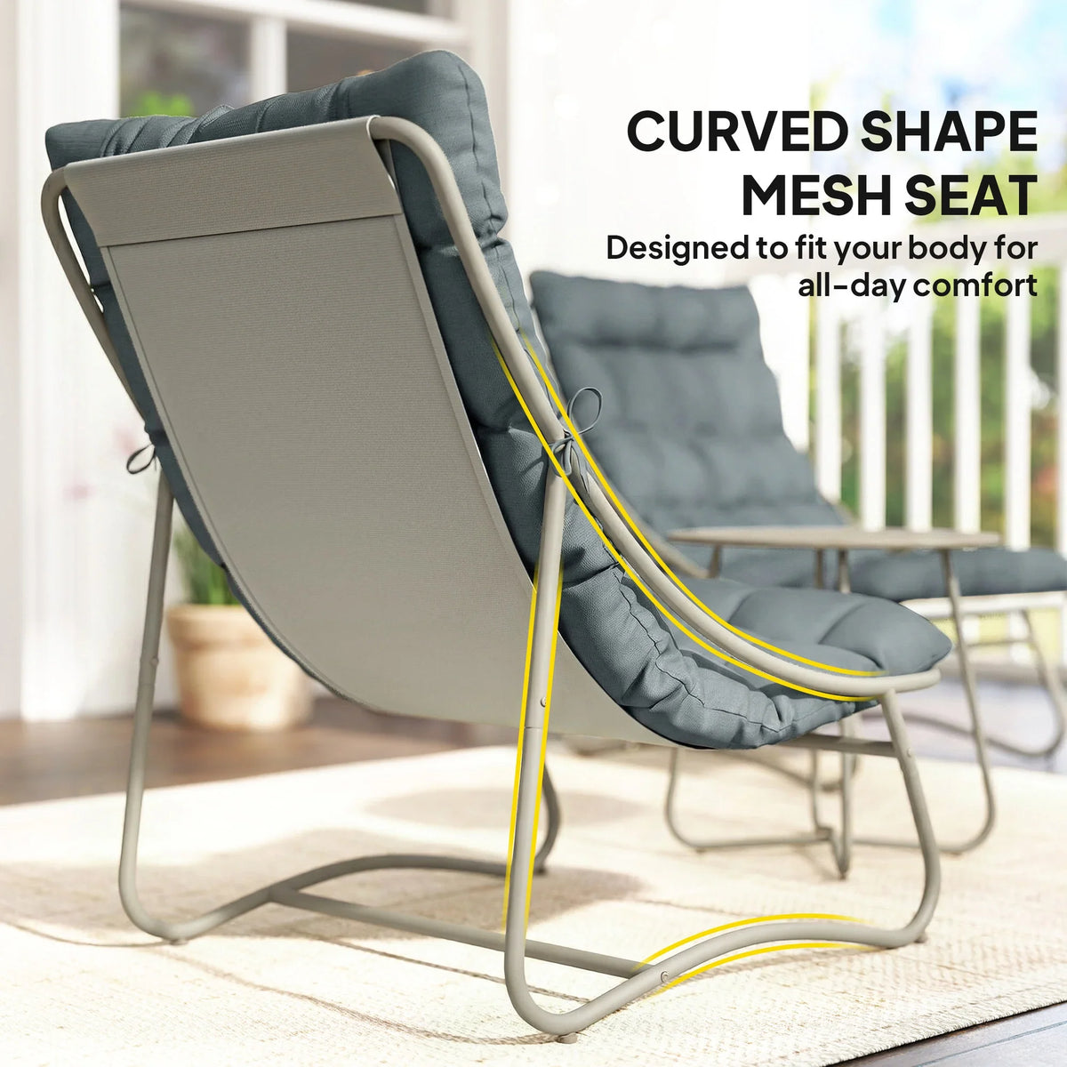 Dark grey curved mesh seat outdoor lounge chair with padded back and footrest