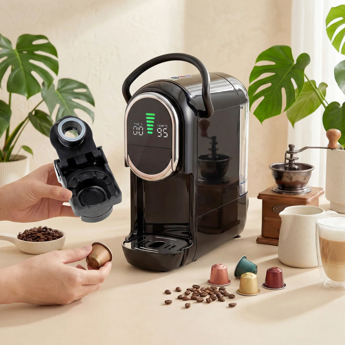 Black pod coffee machine with open capsule compartment and accessory pods