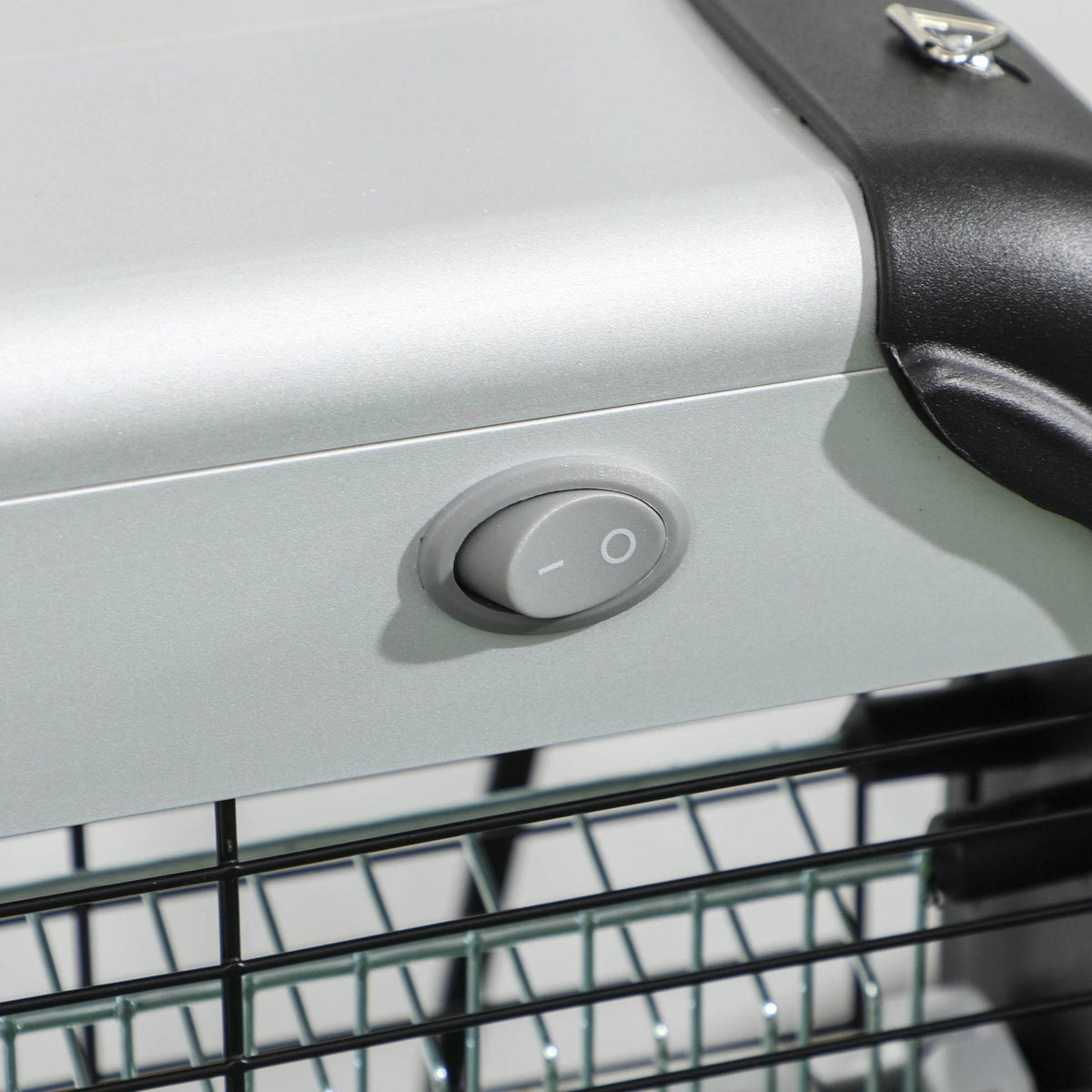 Electric mosquito zapper power switch button on silver top panel