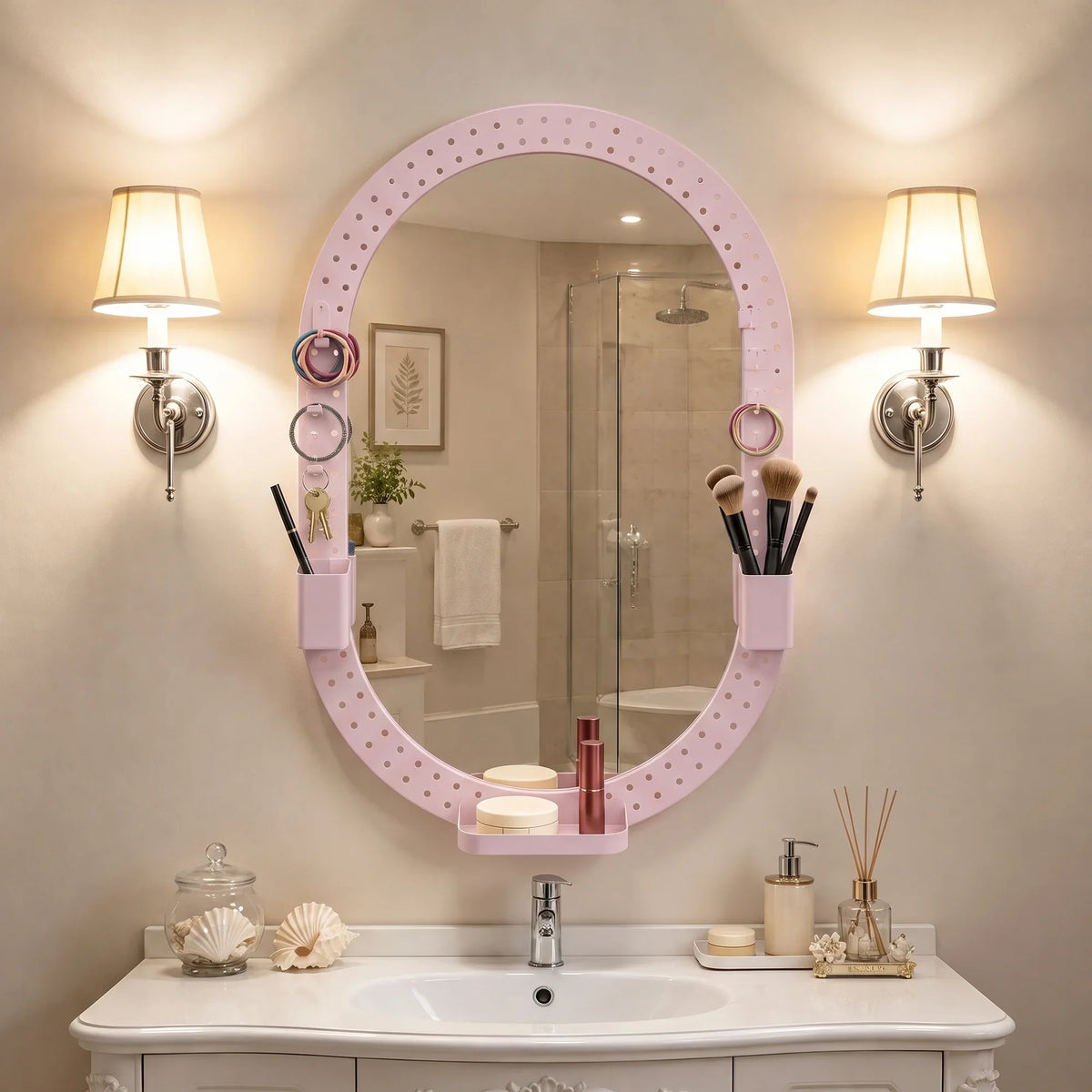 Oval wall mirror with pink pegboard frame and hanging hooks for bathroom essentials