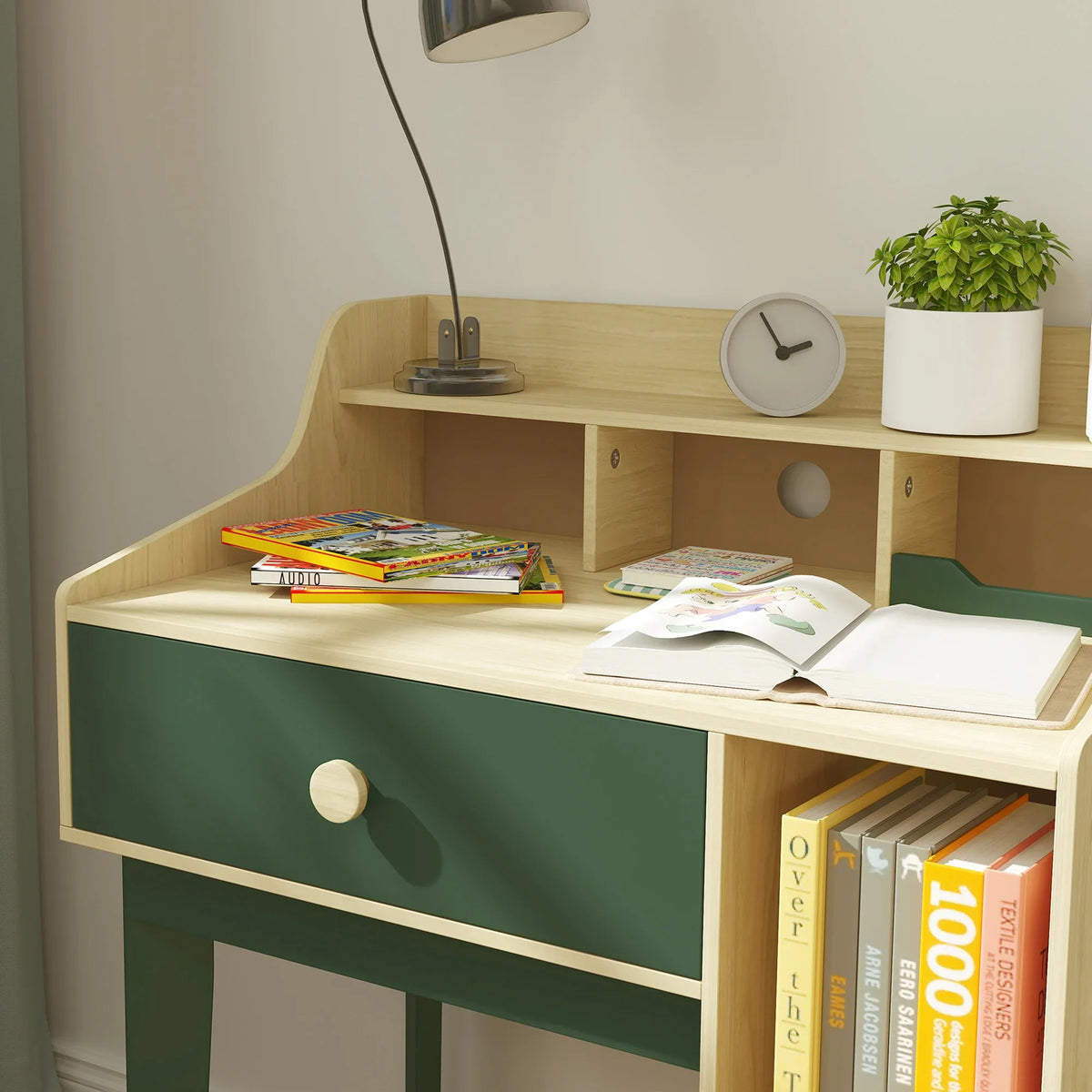 Kids desk and chair set close-up: green drawer front with light wood shelves and tabletop